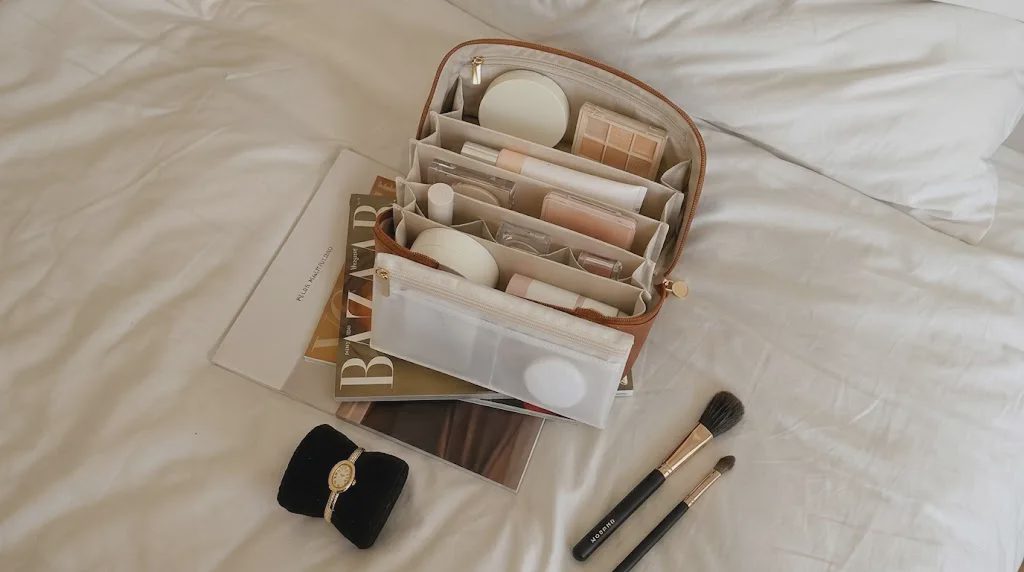 layflat cosmetic bag fully open showing brush case and inner pockets